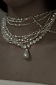 Layers of Keshi and freshwater pearls intertwine, anchored by a focal drop pearl accent— the epitome of regal + demure elegance. #bridal #antibride #modern #bride #statement #earrings #gown #weddinginspiration #pinterestinspiration #weddingday #weddingstyle #bridalinspo #modernbride #romanticbridal Pearl Necklace Outfit, Sapphire Jewelry Set, Bridal Jewelry Sets Brides, Wedding Jewelry Sets Bridal Jewellery, Layered Pearl Necklace, Pearl Jewels, Pearl And Diamond Necklace, Pearl Necklace Wedding, Traditional Earrings