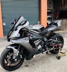 a motorcycle parked in front of a garage