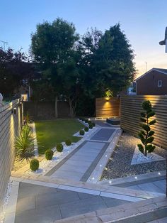 an outdoor garden with lights and landscaping