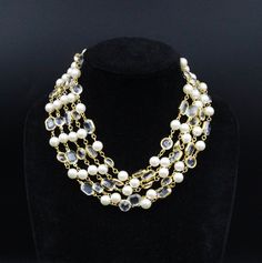 "DESCRIPTION: This vintage necklace by Balmain, dating back to the 1980s, is a true testament to the fashion house's timeless elegance. Comprising a multitude of strands, it seamlessly blends faux pearls with shimmering crystal acrylic beads, creating an alluring and luxurious piece. Marked with the prestigious \"PIERRE BALMAIN PARIS\" label, this necklace reflects the high fashion aesthetics that the brand is renowned for. Its multi-strand design lends it a captivating cascading effect, which b Evening Multi-strand Costume Jewelry Necklace, Formal Multi-strand Costume Jewelry Necklaces, Costume Multi-strand Pearl Necklace For Party, Multi-strand Pearl Necklace For Party, Vintage Balmain, Balmain Paris, Fashion Aesthetics, French Designer, Heart Dangle Earrings