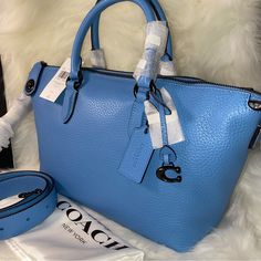 Coach Cara Satchel New With Tags And Original Packaging Dust Bag Included 100 % Authentic Pool Color With Pewter Color Hardware Soft Pebble Leather Zip Closure Handles With 4 1/2" Drop Long Strap With 21 1/2" Drop Included Four Protective Feet At Base Approximate Measurements 10 1/2" L X 7 1/2" H X 5 1/2" W Smoke And Pets Free Blue Textured Leather Evening Bag, Light Blue Satchel With Detachable Handle, Blue Formal Satchel With Branded Hardware, Light Blue Satchel For Shopping, Elegant Light Blue Satchel For Shopping, Blue Textured Leather Satchel With Double Handle, Blue Textured Leather Shoulder Bag For Shopping, Blue Textured Leather Top Handle Satchel, Blue Textured Leather Top Handle Bag