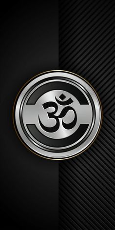 an om symbol on a black and silver background