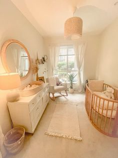 a baby's room with a crib, rocking chair and dresser in it