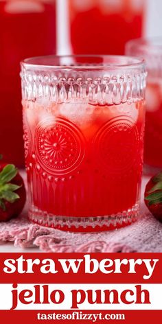 strawberry jello punch in a glass with strawberries on the side and text overlay