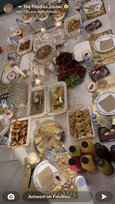 the table is covered with many different types of food