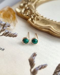 Genuine Malachite Stud Earrings 4 mm with choices of 14K Gold filled, Rose Gold Filled and Sterling Silver 💚  * Gemstone Size: 4mm ✨Malachite gemstone meaning ✨ * Malachite is known as a stone of transformation. It opens the heart to harmony. Helps reveal and heal emotional pain. It has been used to bring ease during transitional times and personal growth.  * 14K gold-filled and Sterling Silver is known for its lasting quality. These earrings will last for decades and are considered lifetime pi Dainty Round Earrings For May Birthstone, Gemstone Meanings, Earring Cards, Green Gemstones, Unique Charms, Jewelry Earrings Studs, Handmade Earrings, Beautiful Earrings, Allergies