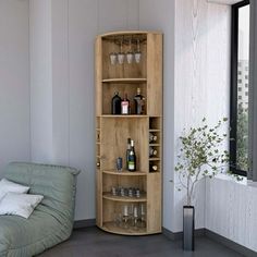 a living room filled with furniture and lots of bottles on top of the shelves next to a window