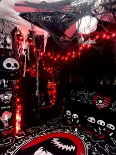 a bedroom decorated for halloween with skulls and lights