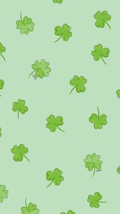 four leaf clovers on a green background for st patrick's day wallpaper