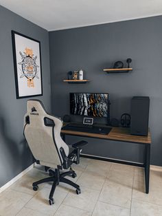 a chair and desk in a room with gray walls