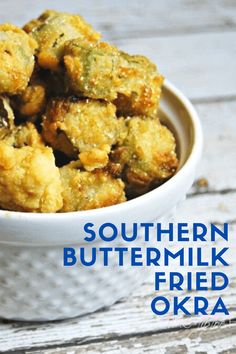 a white bowl filled with fried food on top of a wooden table