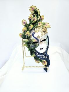 This mask is cast in resin and hand painted with tons of embelishments. Stunning colors. Beautiful peace of work for any wall.  Aprox Dim. 13.5"x6.5" Artistic Masquerade Mask For Mardi Gras, Artistic Masks And Prosthetics For Themed Events, Artistic Masks And Prosthetics For Mardi Gras, Handmade Artistic Masquerade Mask For Mardi Gras, Hand Painted White Masks For Masquerade, Artistic Multicolor Masquerade Mask For Mardi Gras, Artistic Handmade Masks For Mardi Gras, Artistic Multicolor Masquerade Mask For Carnival, Hand Painted Masks For Masquerade Carnival