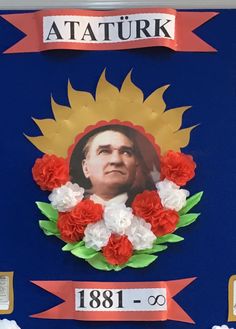 the portrait of atatur is displayed on a blue wall with red and white flowers