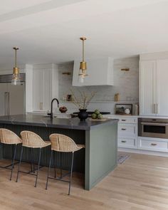 an image of a kitchen with chairs in it and a yellow circle over the photo