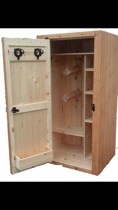 an open wooden cabinet with two doors on the front and one door opened to reveal something inside