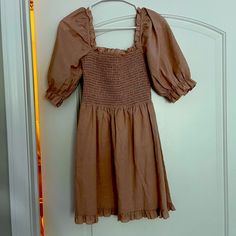 Mini Dress Size Small From Anthropologie. Never Worn Casual Knee-length Puff Sleeve Dress For Date Night, Spring Brown Midi Dress With Smocked Bodice, Fall Puff Sleeve Mini Dress For Day Out, Fall Mini Length Puff Sleeve Dress, Date Night Dress With Smocked Bodice, Mini Length, Brown A-line Dress With Ruffles, Brown Smocked Back Dress For Brunch, Spring Brown Midi Dress With Short Sleeves, Brown Short Sleeve Midi Dress For Spring