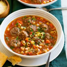 two bowls of soup with meatballs and vegetables