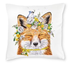 a white pillow with a drawing of a fox and bird on it's head