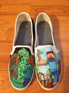 a pair of shoes that are on top of a wooden floor with minecraft painted on them