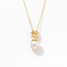 1- D E S C R I P T I O N Designed with a touch of elegance, this Diamond Star of David Pearl Necklace is a stunning 14k gold piece that exudes timeless beauty. The Star of David pendant, adorned with a pearl, adds a unique charm to this jewelry. Perfect as a gift for her, this necklace is more than just an accessory, it's a symbol of faith and love. Crafted with precision, it's a must-have for those seeking high-quality Star of David Pearl Jewelry. 2- P R O D U C T ∙ F E A T U R E S * Gold mater Elegant Star-shaped Jewelry For Gifts, Elegant Star-shaped Jewelry Gift, Fine Jewelry Star-shaped For Formal Occasions, Fine Star-shaped Jewelry For Formal Occasion, Formal White Gold Star Charm Jewelry, Formal White Gold Star Of David Necklace, Formal White Gold Jewelry With Star Charm, White Star-shaped Formal Jewelry, Luxury Star-shaped Jewelry For Formal Events