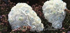 two bridal bouquets made out of white roses