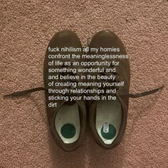 a pair of shoes sitting on top of a carpeted floor next to a wall