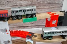 a toy train set on a wooden track