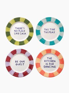 four colorful plates with words on them