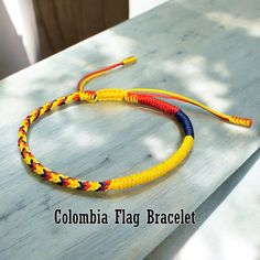 DIY Tuelam welcomes you! Thank you for visiting my store! "The Colombia Bracelet" is hand-braided from nylon cord in the Colombia pride flag. So, it is very durable, very safe, hypoallergenic and comfortable to use. It is not only a bracelet, it will be a witness of your great love. Whether you're showing pride or supporting it with this bracelet, both are equally awesome. Wish the good things for everyone! Adjustable Wrist Size from 14cm - 24cm. If you need a smaller measure or want to adjust t Colombia Bracelet, Bracelets Colors, Patriotic Bracelet, Flag Bracelet, Colombia Flag, Pride Bracelet, Patriotic Gifts, Pride Flag, Colorful Bracelets