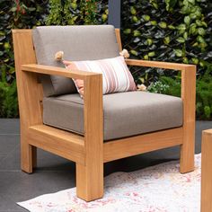 a wooden chair sitting on top of a rug