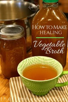 a bowl of vegetable broth next to a jar of honey