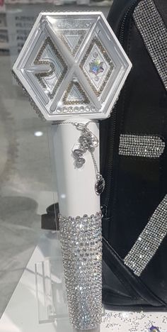 a white and silver object on display in a store window