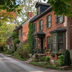 an old brick house with ivy growing on it's windows