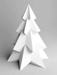 an origami christmas tree on a gray background