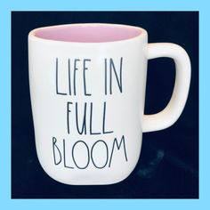 a coffee mug with writing on it that says life in full bloom and the words,