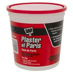 a bucket of plaster that is red and white with the words plaster of paris on it