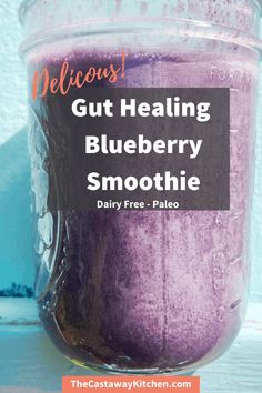 blueberry smoothie in a glass jar with the words delicious gutting blueberry smoothie