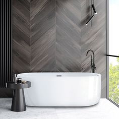 a white bathtub sitting next to a window in a bathroom with wood wallpaper