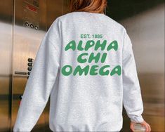 Soft, cute, and trendy, this Alpha Chi Omega Bubble Text sorority crewneck will quickly become your go-to cozy sweatshirt! Use the drop down to specify preference between white, ash, light pink, sand, or light blue.  LISTING IS FOR ALPHA CHI OMEGA. Please be sure you are ordering for your correct Sorority. We only print on high quality, soft, & heavyweight materials, sustainably made and printed in the US. ♥ SIZING ♥ Unisex Sizing- For a more feminine, fitted look we recommend getting your size. Sorority Crewneck, Bubble Font, Alpha Epsilon Phi, Big Little Gifts, Alpha Sigma Alpha, Alpha Chi Omega, Alpha Delta, White Ash, Sigma Kappa