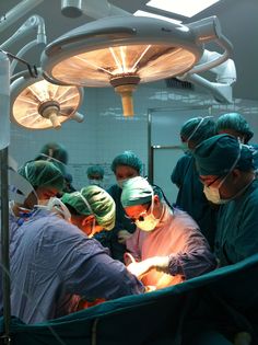 doctors performing surgery in an operating room