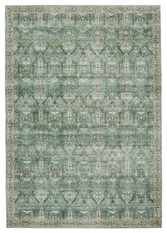 an area rug with green and beige colors