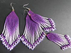 two pairs of purple and white beaded earrings