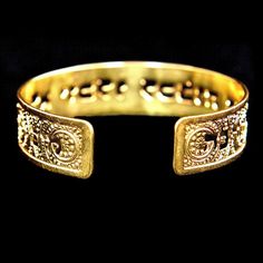 Gold cuff with a Psalms verse inscribed around it in biblical Hebrew font. 1/2 inch tall cuff dipped in gold with an engraved design. Part of the Judaica jewelry collection I call "Keren Or". The texture on the cuff is incredible - it has the feel of diamond cut that is so bright it shines. The picture truly does not do it justice. The gold cuff is about 6 inches around with about an inch opening. It has some adjustability. The cuff is made of gold plated brass. The cuff has the following verse Symbolic Stamped Cuff Bangle Bracelet, Gold Adjustable Stamped Cuff Bracelet, Adjustable Spiritual Bracelets For Ceremonial Use, Adjustable Gold Stamped Cuff Bracelet, Adjustable Stamped Gold Cuff Bracelet, Adjustable Etched Gold Cuff Bracelet, Adjustable Symbolic Bracelets For Ceremonial Occasions, Gold Symbolic Engraved Cuff Bracelet, Spiritual Engraved Bangle For Weddings