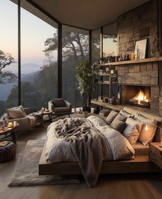 a bedroom with a large bed and fireplace in the corner, surrounded by glass walls