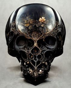 a black and gold skull with flowers on it's head is shown in front of a gray background