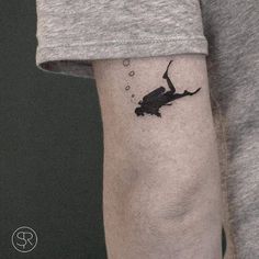 a person with a small tattoo on their arm