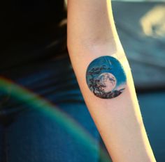 a person with a small tattoo on their arm