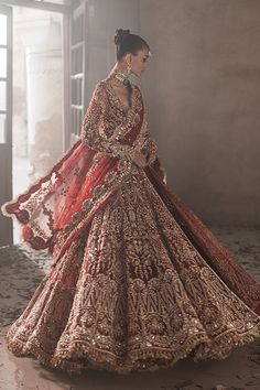 Pakistani Bridal Red Lehenga and Embellished Gown Dress is a stunning masterpiece, hand-embellished with Mukaish, Gold ornaments, and Shimmering details. Baraat Dress Pakistani Bridal Wear Red, Trending Bridal Lehenga 2024, Desi Wedding Dresses Pakistani Bridal, Red Lengha Bridal, Pakistani Bridal Wear Red, Pakistani Bridal Red, Gold Pakistani Bridal Dress, Indian Bridal Lehenga Red, Gold Bridal Gown