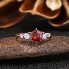 a close up of a ring on top of a rock