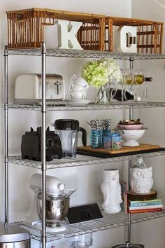 the shelves are filled with kitchen items and dishes